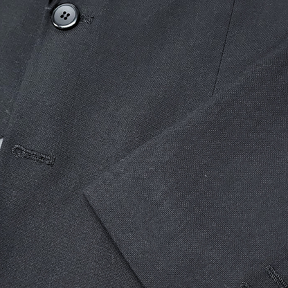 Traje ModernFit lanilla stretch color negro texturizado.