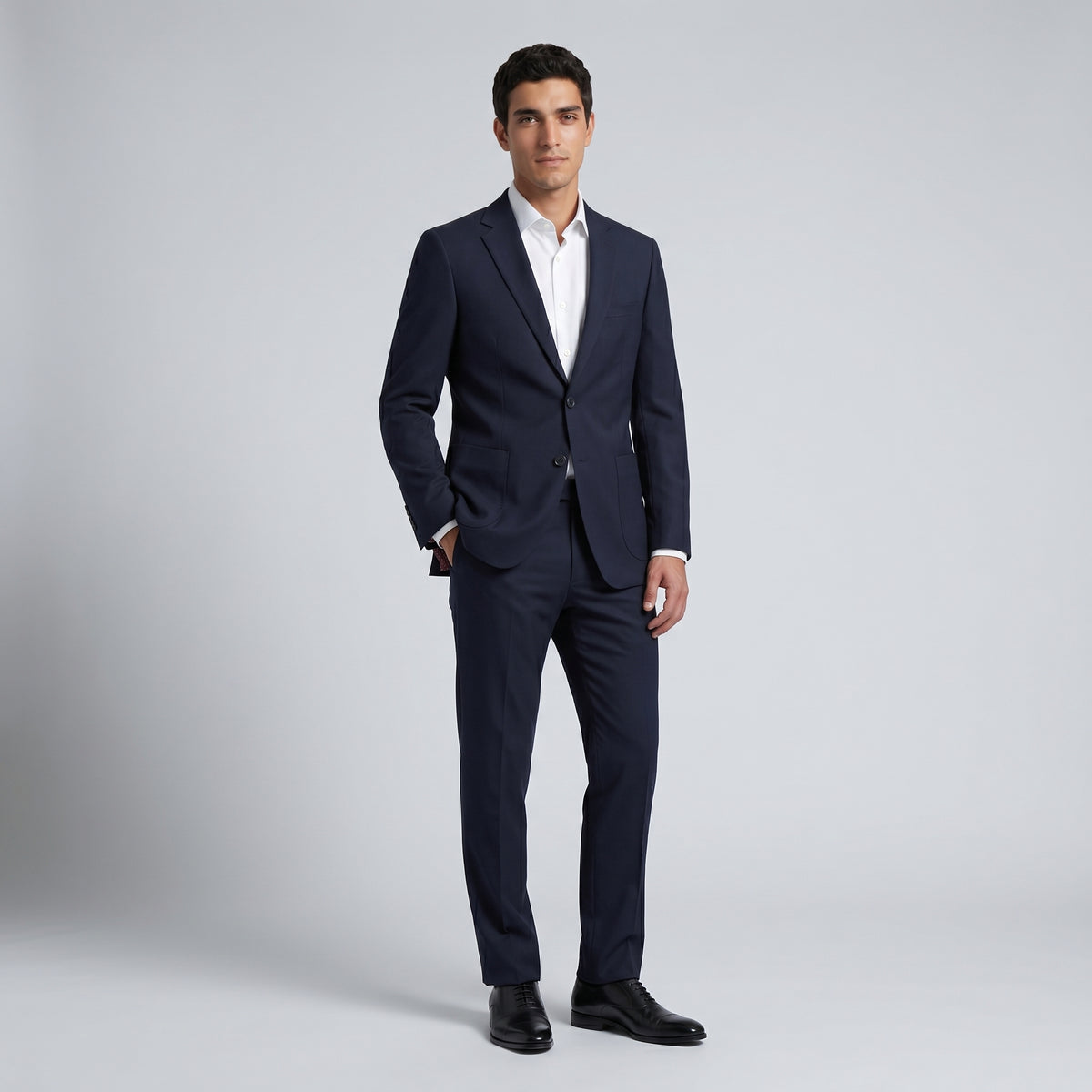 Traje casual  ModernFit lanilla stretch color negro bolsillo parche texturizado.